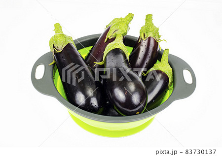 Clean washed eggplant for cooking in colander. Studio Photo. Clean washed eggplant for cooking in colander. Studio Photo. 83730137