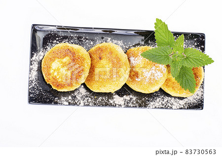 Sweet cottage cheese pancakes on plate, dairy products. Studio Photo. 83730563