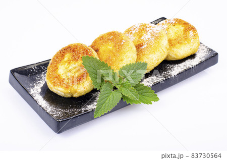 Sweet cottage cheese pancakes on plate, dairy products. Studio Photo. Sweet cottage cheese pancakes on plate, dairy products. Studio Photo. 83730564