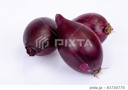 Heads of red onions on white background. Studio Photo. Heads of red onions on white background. Studio Photo. 83730770