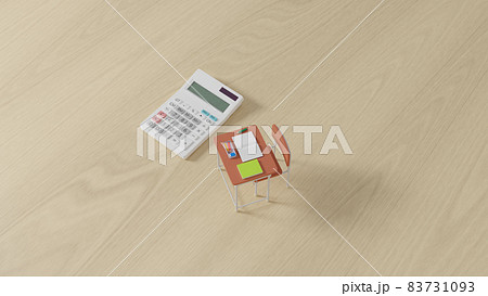 平面上に置かれたミニチュアのスクールデスクと電卓 平面上に置かれたミニチュアのスクールデスクと電卓 83731093