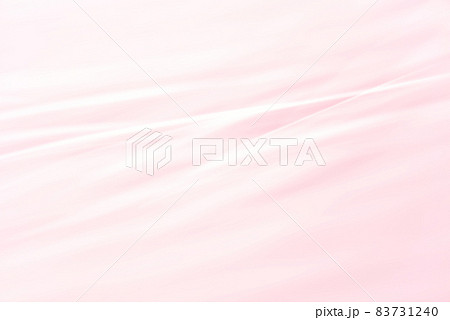 淡いピンク背景に波線が入ったシンプルな背景素材の写真素材