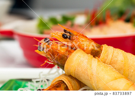 Close up of Fried Shrimps wrapped and crispy fried noodles with various vietnamese food Close up of Fried Shrimps wrapped and crispy fried noodles with various vietnamese food 83733897