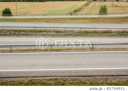 Empty asphalt roads without cars at autumn evening in Finland. Empty asphalt roads without cars at autumn evening in Finland. 83734031