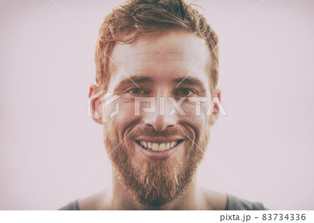 Smiling young happy man with beard - Hairstyle, hipster hair style bearded handsome healthy model. 83734336