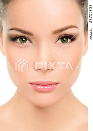 Asian beauty woman. Serious portrait of beautiful mixed race chinese with makeup smokey eyes eyeshadow, mascara, rouge blush on cheeks and lips. Plastic surgery, nose job, facelift. 83734353