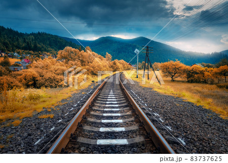 Rural railroad in mountains in overcast day. Old railway Rural railroad in mountains in overcast day. Old railway 83737625