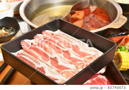 Raw pork slice  in the dish 83740073