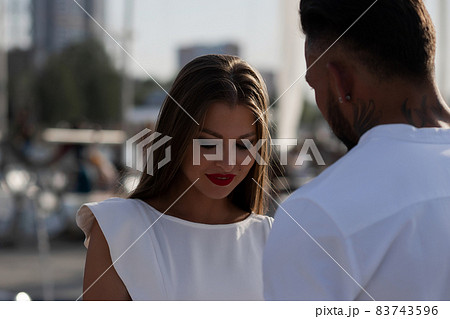 Happy stylish couple hugging in harbor 83743596