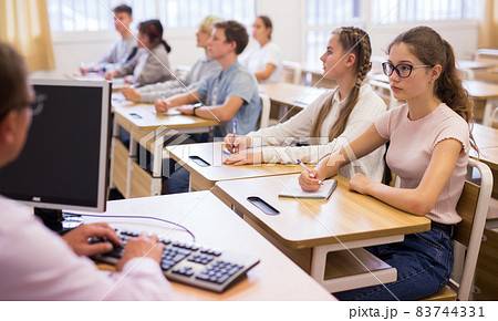 Teenage students working at class during lesson Teenage students working at class during lesson 83744331