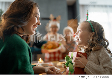 family celebrating Christmas 83745000