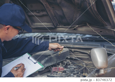 Mechanic car service auto garage in automotive mobile center. Technician workshop repair engine motor vehicles service mechanical engineering business. Automobile mechanic hands car repairs technic 83746372