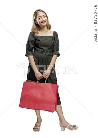 Asian woman carrying shopping bags 83750756
