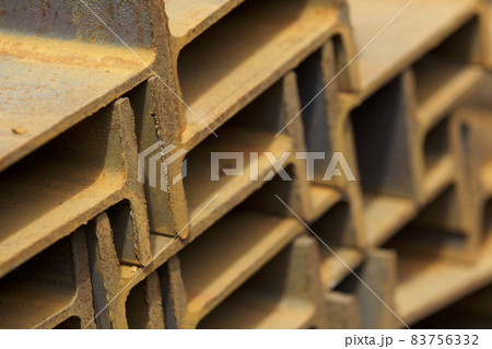 Metal profile beam in packs at the warehouse of metal products Metal profile beam in packs at the warehouse of metal products 83756332