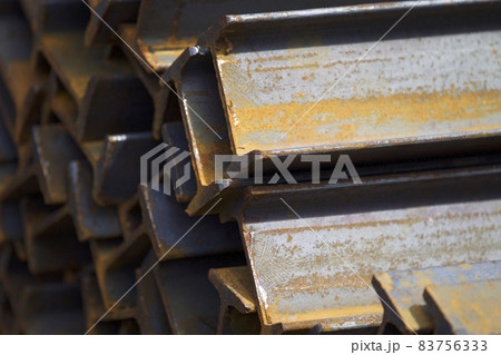Metal profile beam in packs at the warehouse of metal products Metal profile beam in packs at the warehouse of metal products 83756333
