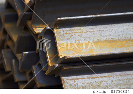 Metal profile beam in packs at the warehouse of metal products Metal profile beam in packs at the warehouse of metal products 83756334