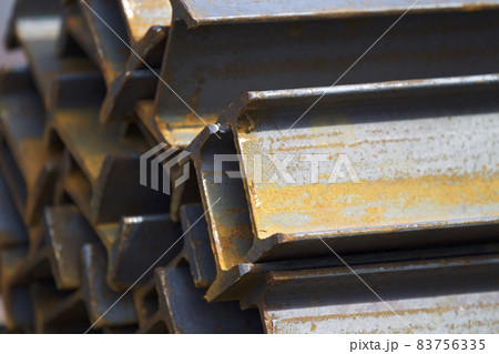 Metal profile beam in packs at the warehouse of metal products Metal profile beam in packs at the warehouse of metal products 83756335