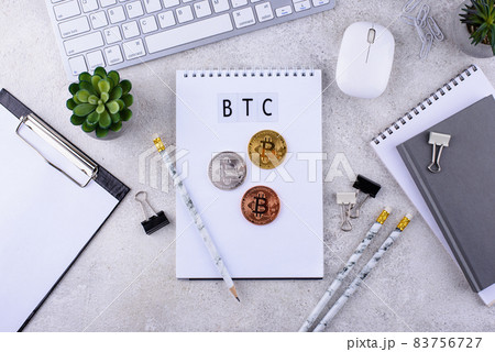 Bitcoin coins on office desk. Cryptocurrency concept Bitcoin coins on office desk. Cryptocurrency concept 83756727