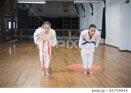 Beautiful young women starting karate training 83759944