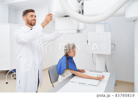 Radiologist regulating ultra sound tool preparing for diagnostic. Radiologist regulating ultra sound tool preparing for diagnostic. 83760819