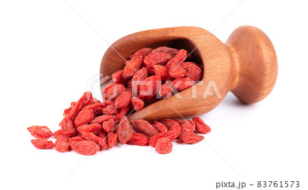 Chinese wolfberries in wooden scoop, isolated on white background. Heap of dried goji berry. Chinese wolfberries in wooden scoop, isolated on white background. Heap of dried goji berry. 83761573