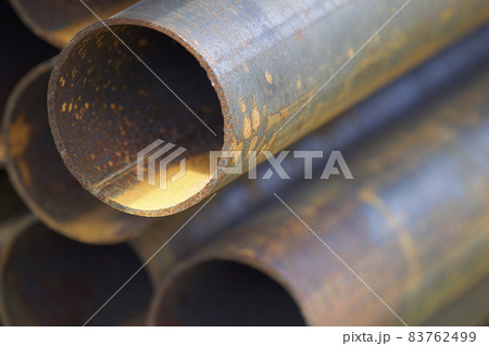 Metal profile pipe of round section in packs at the warehouse of metal products Metal profile pipe of round section in packs at the warehouse of metal products 83762499