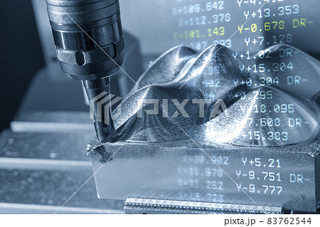 The abstract scene CNC milling machine rough cutting  the mold and die parts and G-code data background. 83762544