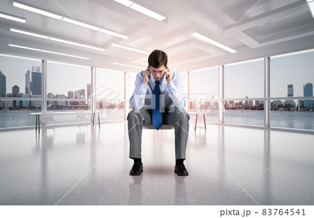 young businessman on chair in office 83764541