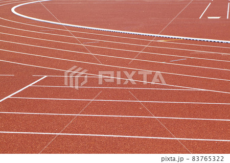 The curved lane in running track or athlete track in stadium. Running track is a rubberized artificial running surface for track and field athletics The curved lane in running track or athlete track in stadium. Running track is a rubberized artificial running surface for track and field athletics 83765322