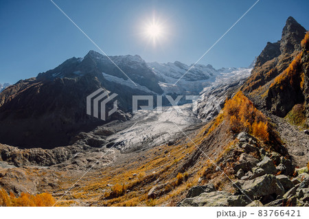 Rocky mountains and glacier. Peak of mountain and glacier in sunny day 83766421