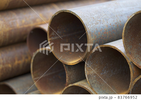 Metal profile pipe of round section in packs at the warehouse of metal products Metal profile pipe of round section in packs at the warehouse of metal products 83766952