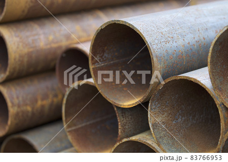 Metal profile pipe of round section in packs at the warehouse of metal products Metal profile pipe of round section in packs at the warehouse of metal products 83766953