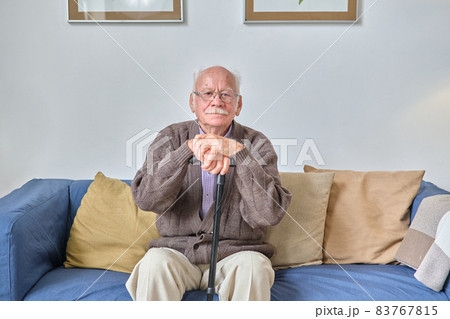 Senior man sitting on sofa and resting Senior man sitting on sofa and resting 83767815
