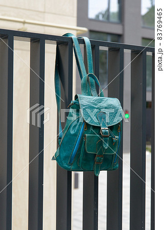 Tiffany leather backpack on the metal fence Tiffany leather backpack on the metal fence 83769465