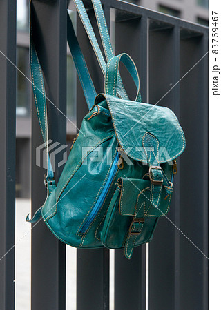Tiffany leather backpack on the metal fence Tiffany leather backpack on the metal fence 83769467
