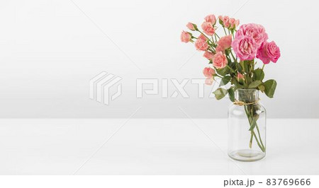 vase with roses table. High quality beautiful photo concept vase with roses table. High quality beautiful photo concept 83769666
