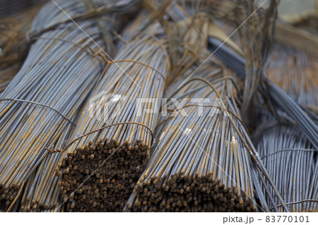 Reinforcing bars with a periodic profile in the packs are stored in the metal products warehouse Reinforcing bars with a periodic profile in the packs are stored in the metal products warehouse 83770101