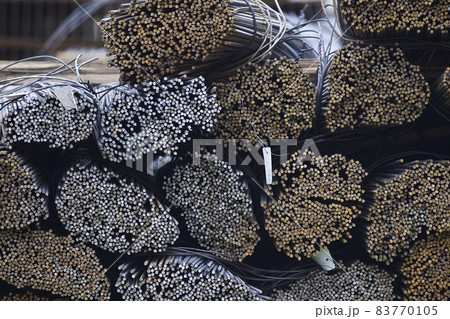Reinforcing bars with a periodic profile in the packs are stored in the metal products warehouse Reinforcing bars with a periodic profile in the packs are stored in the metal products warehouse 83770105