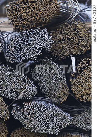 Reinforcing bars with a periodic profile in the packs are stored in the metal products warehouse Reinforcing bars with a periodic profile in the packs are stored in the metal products warehouse 83770107