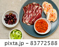 Plate with Bulgarian salami - babek, cheese and chutney 83772588