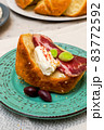 A slice of bread with Bulgarian salami, cheese and chutney 83772592