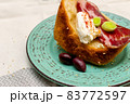 A slice of bread with Bulgarian salami, cheese and chutney 83772597