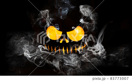 Halloween pumpkin face with burning fire inside. 83773007