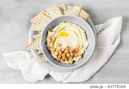 top view hummus with chickpeas nacho chips. High quality beautiful photo concept 83776166