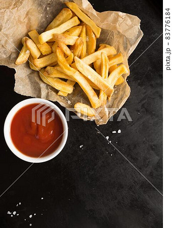 top view salted french fries with ketchup. High quality beautiful photo concept top view salted french fries with ketchup. High quality beautiful photo concept 83776184