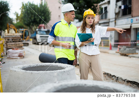 Civil engineers checking work process in construction site Civil engineers checking work process in construction site 83776538