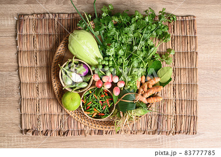 Fresh organic Southeast Asian vegetables and spices from local farmer market, Thailand 83777785