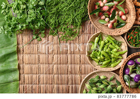 Fresh organic Southeast Asian vegetables and spices from local farmer market, Thailand 83777786