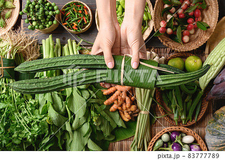 Fresh organic Southeast Asian vegetables and spices from local farmer market, Thailand 83777789