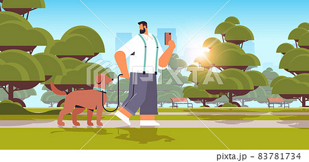 young man walking with dog in urban park male owner and cute domestic animal friendship with pet concept young man walking with dog in urban park male owner and cute domestic animal friendship with pet concept 83781734